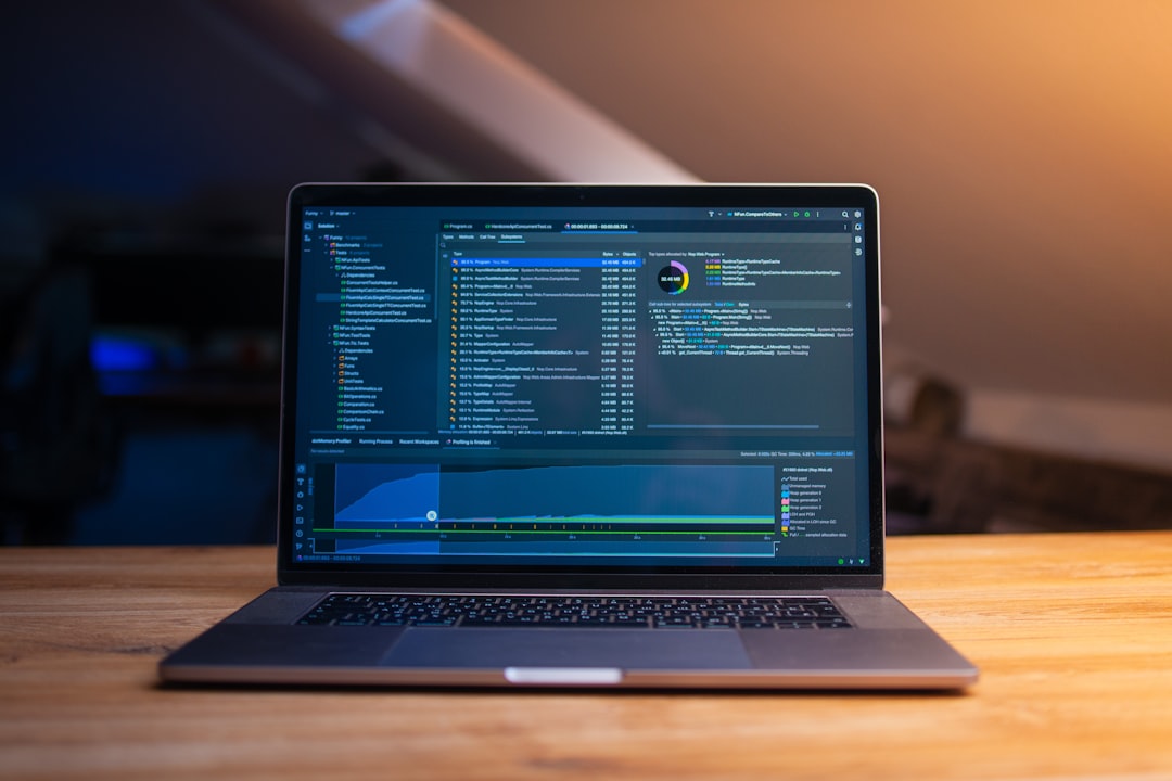 Open-source code on a laptop screen — Bitwarden review based on two years of daily use across desktop, mobile, browser extensions, and self-hosted Vaultwarden