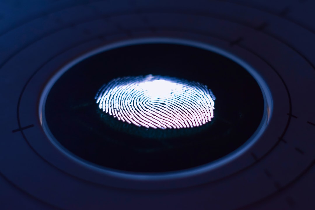 Fingerprint scanner on a hardware security key — Bitwarden\'s passkey support replaces passwords with phishing-resistant FIDO2 credentials
