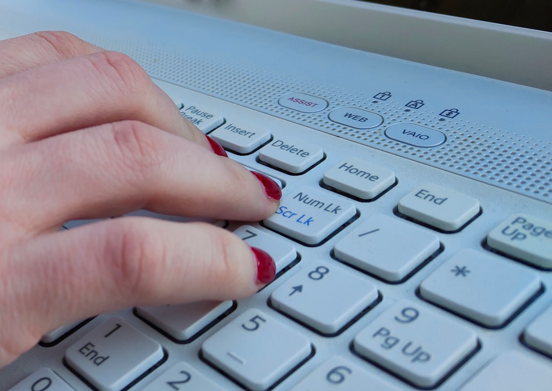 Hands typing on keyboard close up — Bitwarden setup tutorial covers account creation, browser extension and mobile autofill
