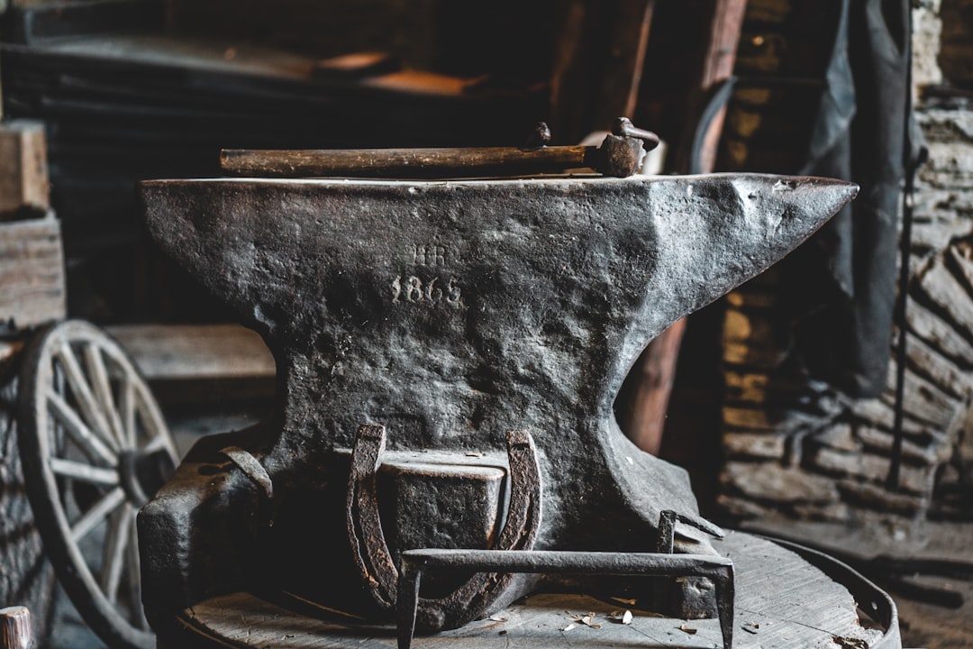 Hand-forged metalwork on an anvil — Vaultwarden, the community-built Rust rewrite of the Bitwarden server
